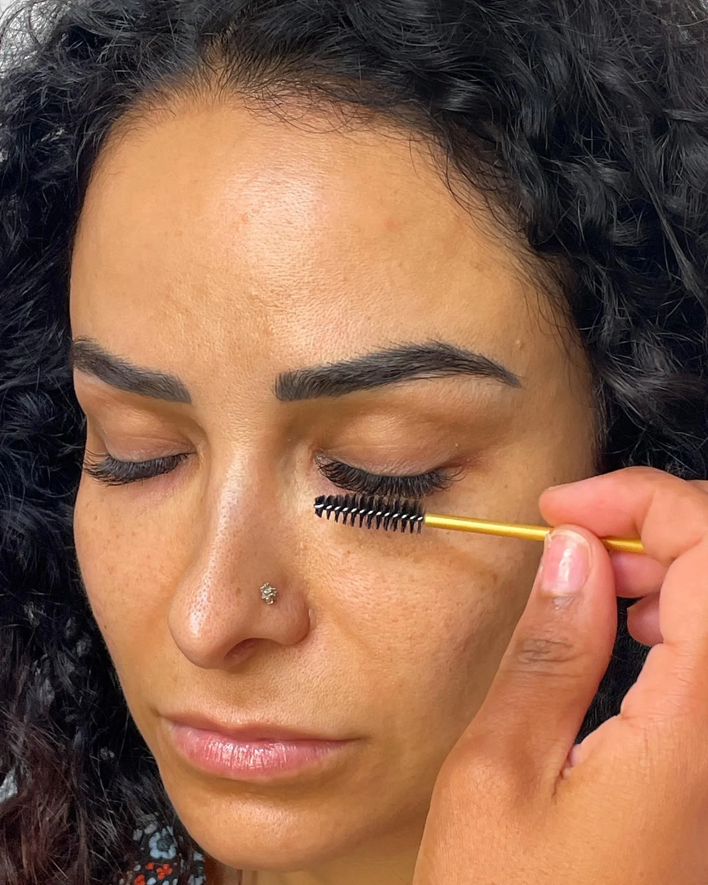 Lash artist at work — meticulous application