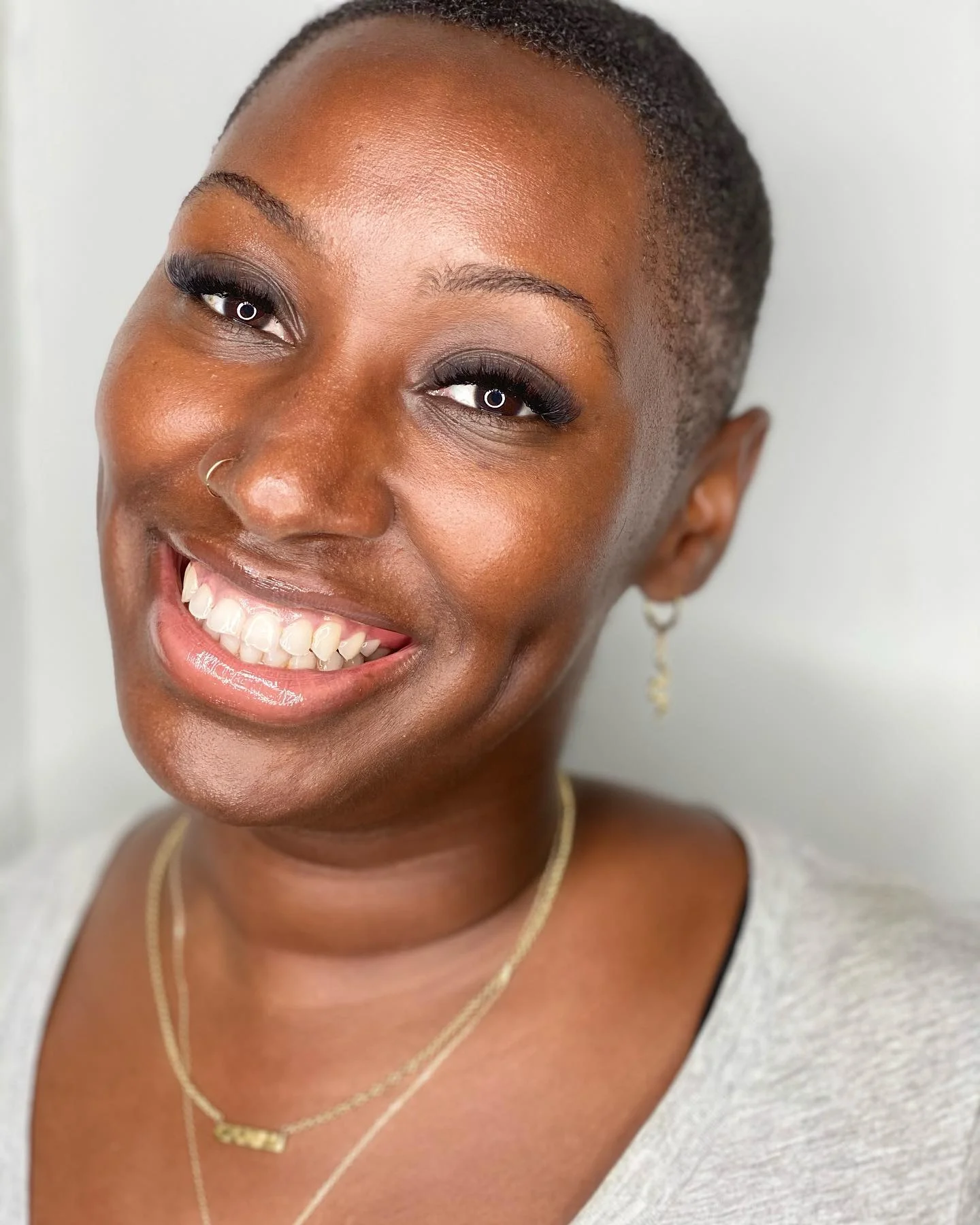 Radiant client showcasing her lash results